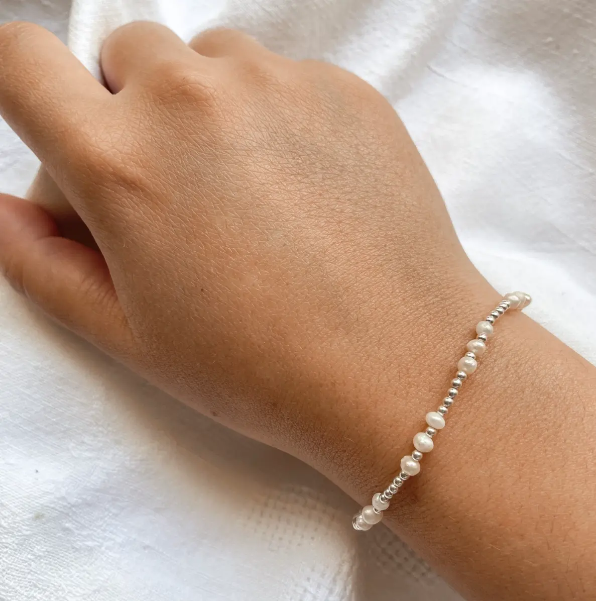 Pink stretch beaded bracelet with silver accents