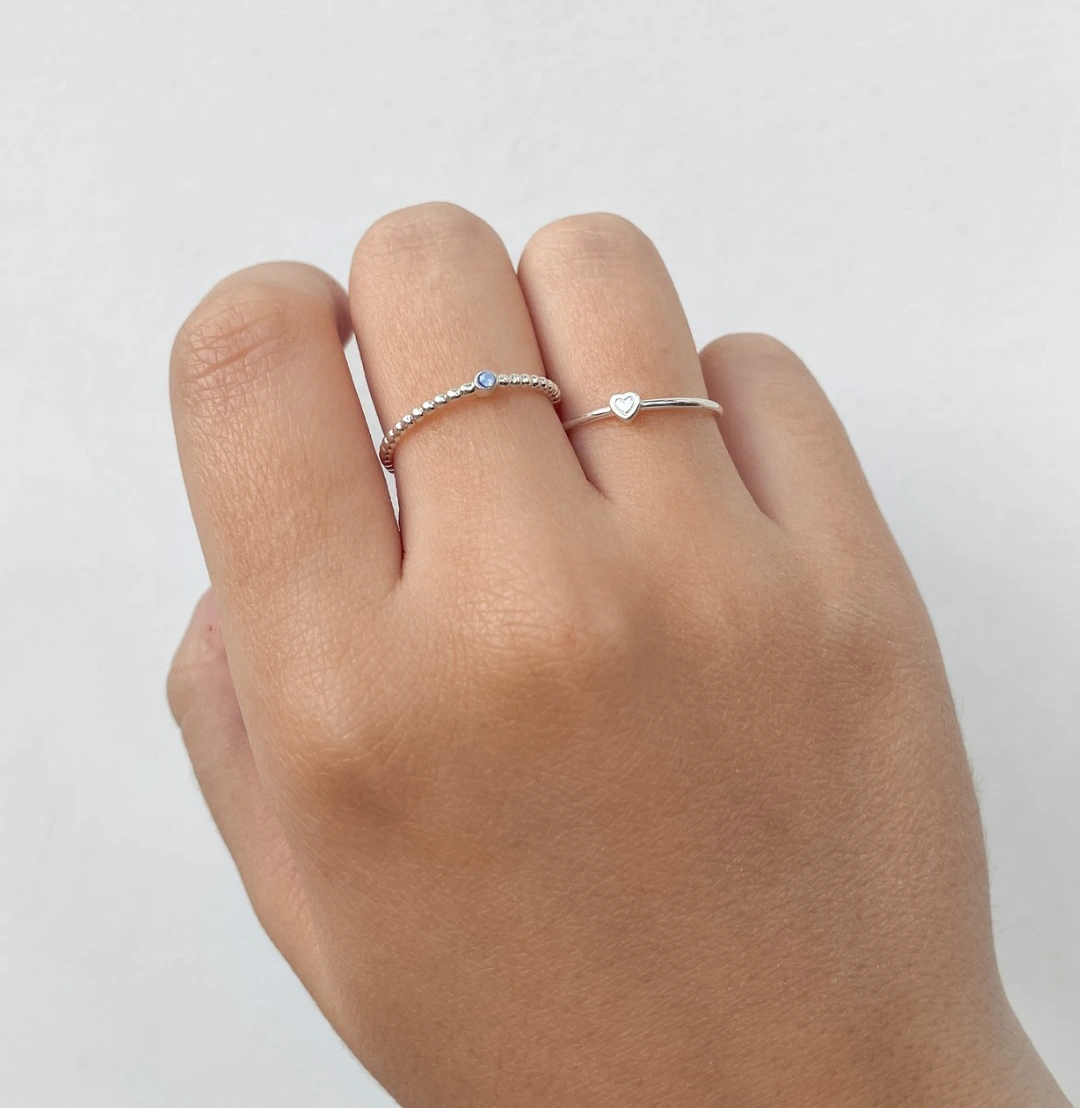 Close up of a twisted stackable sterling silver ring